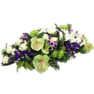 Rouw bloemstuk ovaal paars wit